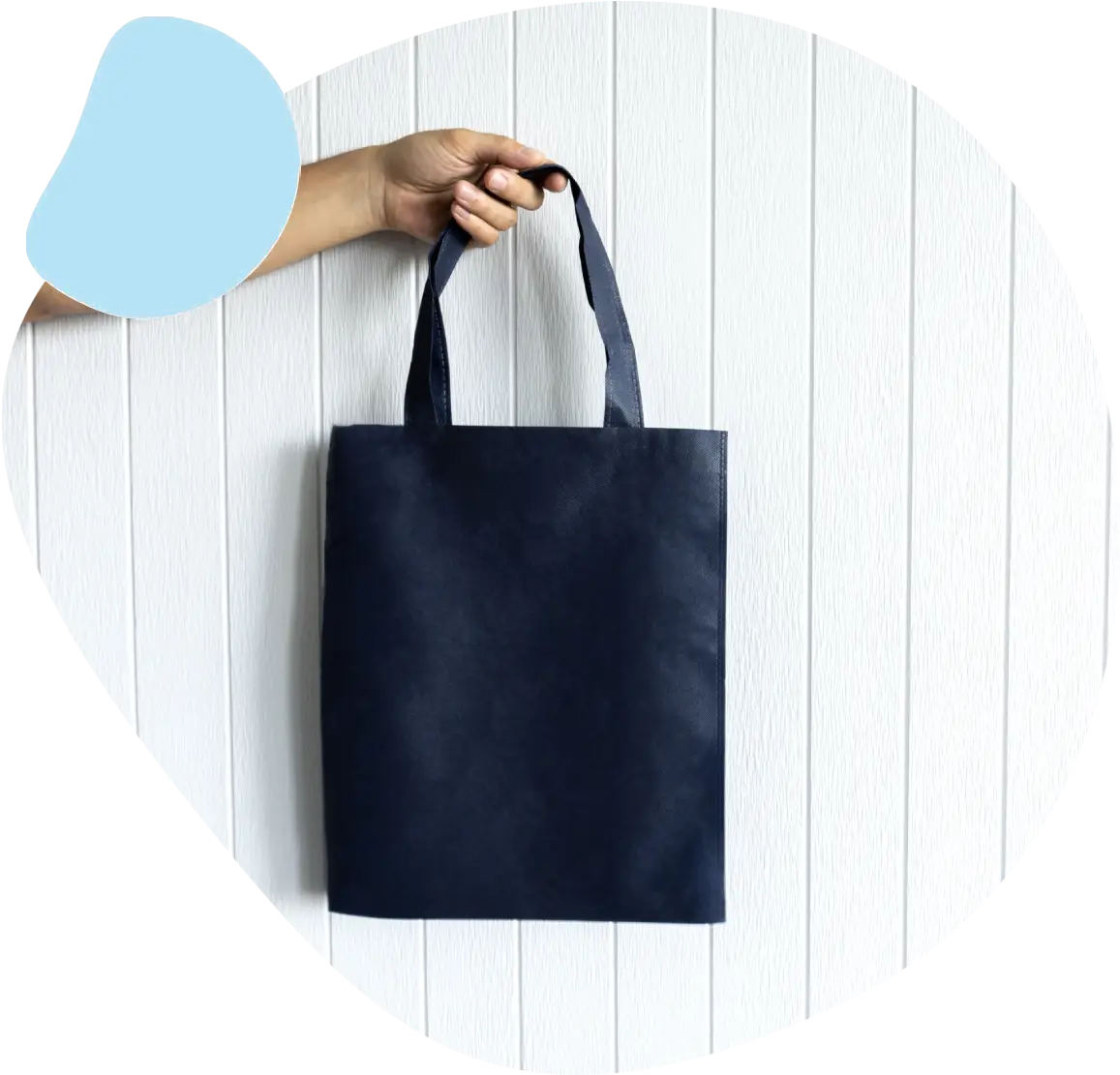 A person holding onto a black bag